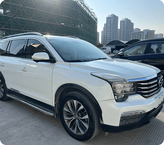 Dark luxury SUV in forest